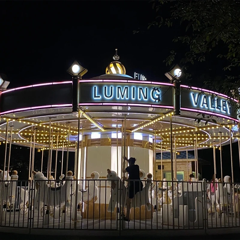 commercial musical carousel with white horses and iron fence